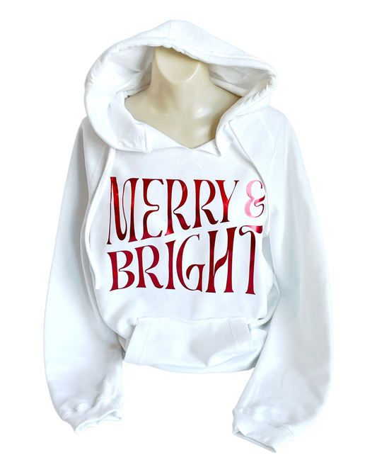 Womens cut super cozy and soft, white hoodie with "Merry & Bright" in a shiny electric red material. 